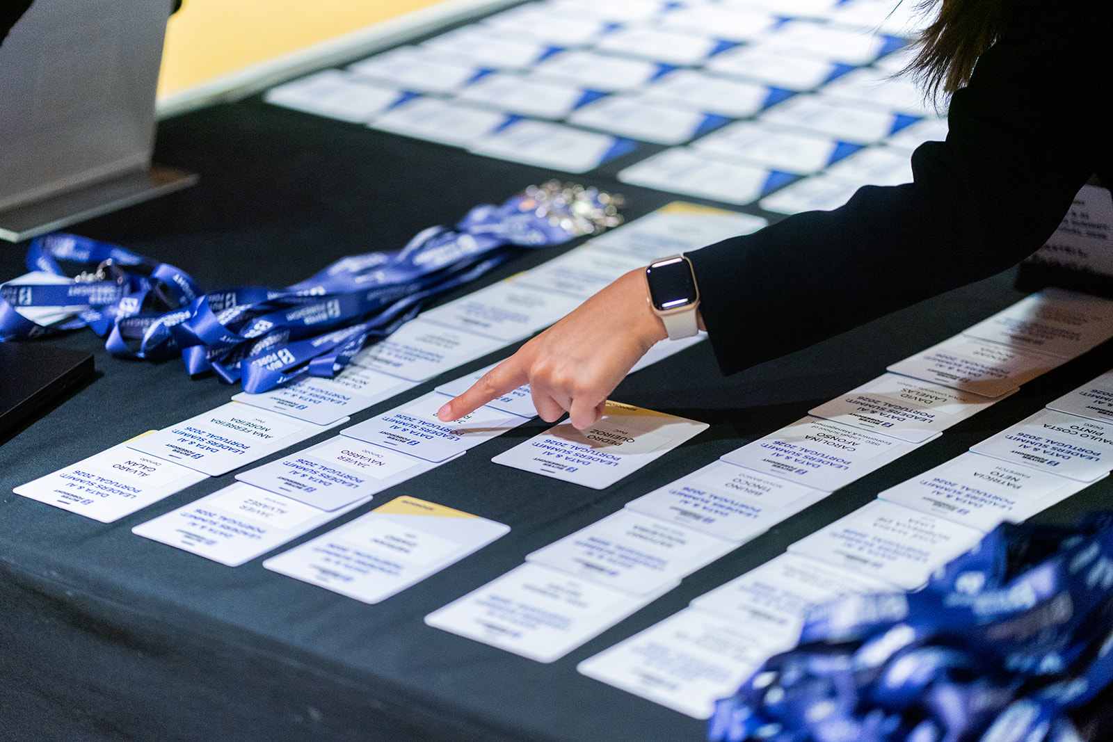 Attendee badges arranged at event registration